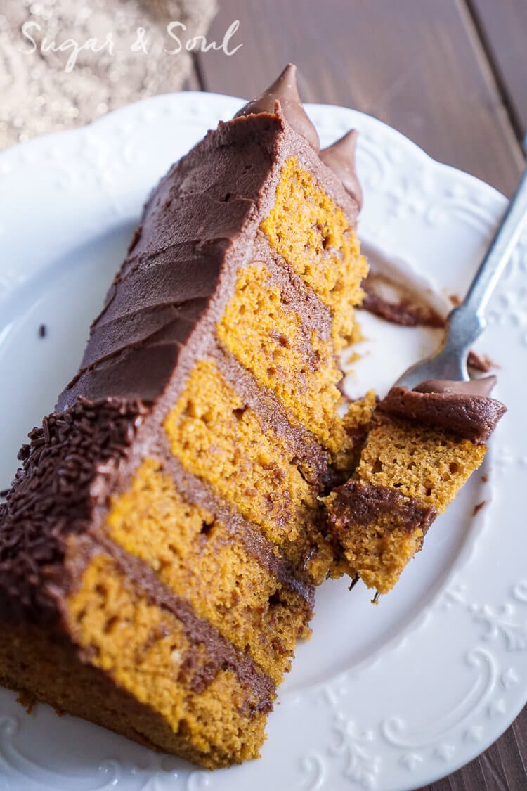 This Chocolate Pumpkin Cake is the ultimate pumpkin and chocolate combo for fall! Five layers of sweet and fluffy pumpkin cake wrapped in a whipped chocolate buttercream frosting!