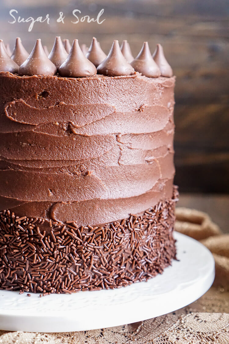 This Chocolate Pumpkin Cake is the ultimate pumpkin and chocolate combo for fall! Five layers of sweet and fluffy pumpkin cake wrapped in a whipped chocolate buttercream frosting!