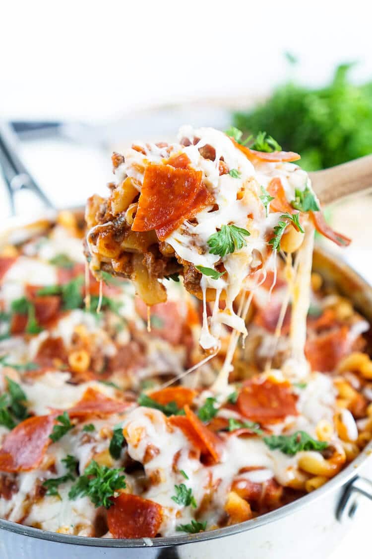 This One Pan Pizza Pasta is what weeknight dreams are made of! Pizza and pasta come together in an easy meal loaded with flavor that's ready in less than 30 minutes!