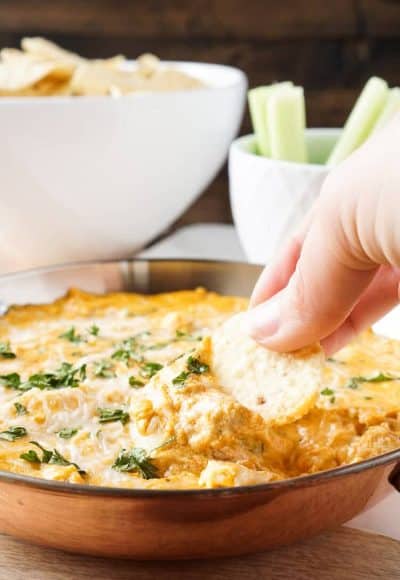 This Baked Buffalo Chicken Dip is made with real cream and blue cheeses, rotisserie chicken, hot sauce and spices for a sensational appetizer that's sure to please! Plus, it's ready in less than 30 minutes!