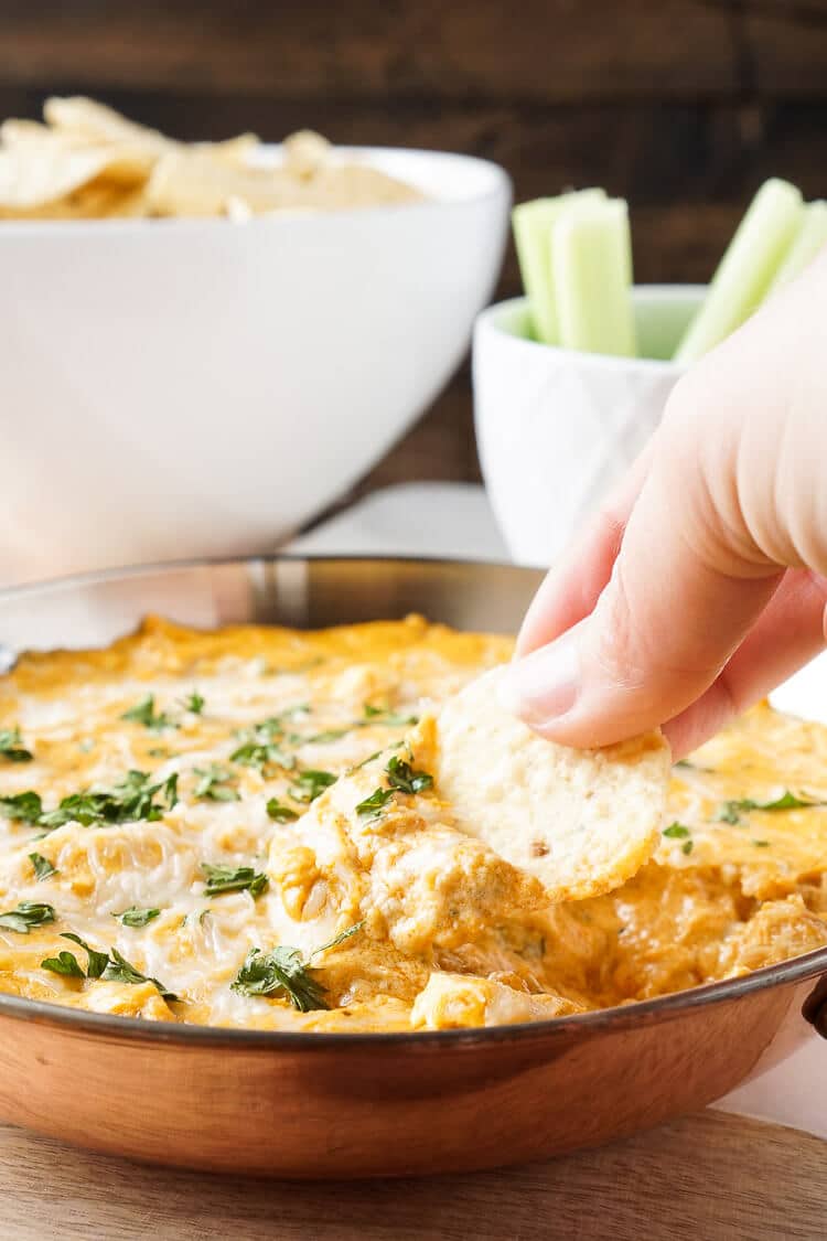 This Baked Buffalo Chicken Dip is made with real cream and blue cheeses, rotisserie chicken, hot sauce and spices for a sensational appetizer that's sure to please! Plus, it's ready in less than 30 minutes!