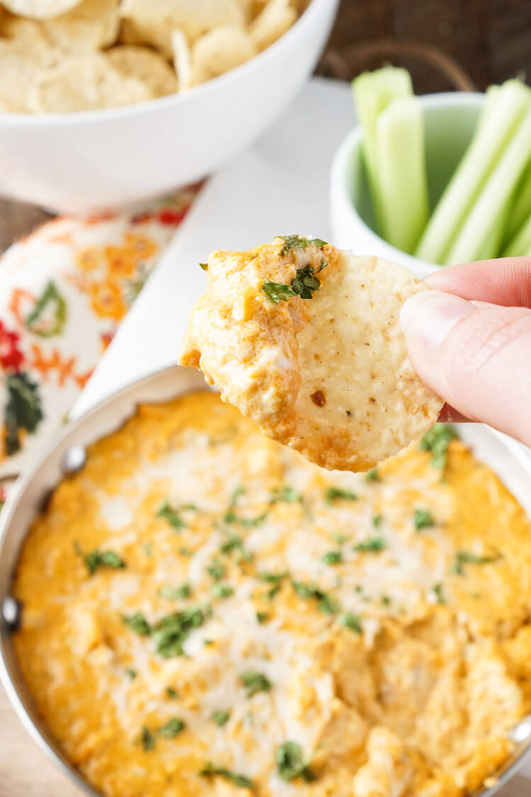 This Baked Buffalo Chicken Dip is made with real cream and blue cheeses, rotisserie chicken, hot sauce and spices for a sensational appetizer that's sure to please! Plus, it's ready in less than 30 minutes!