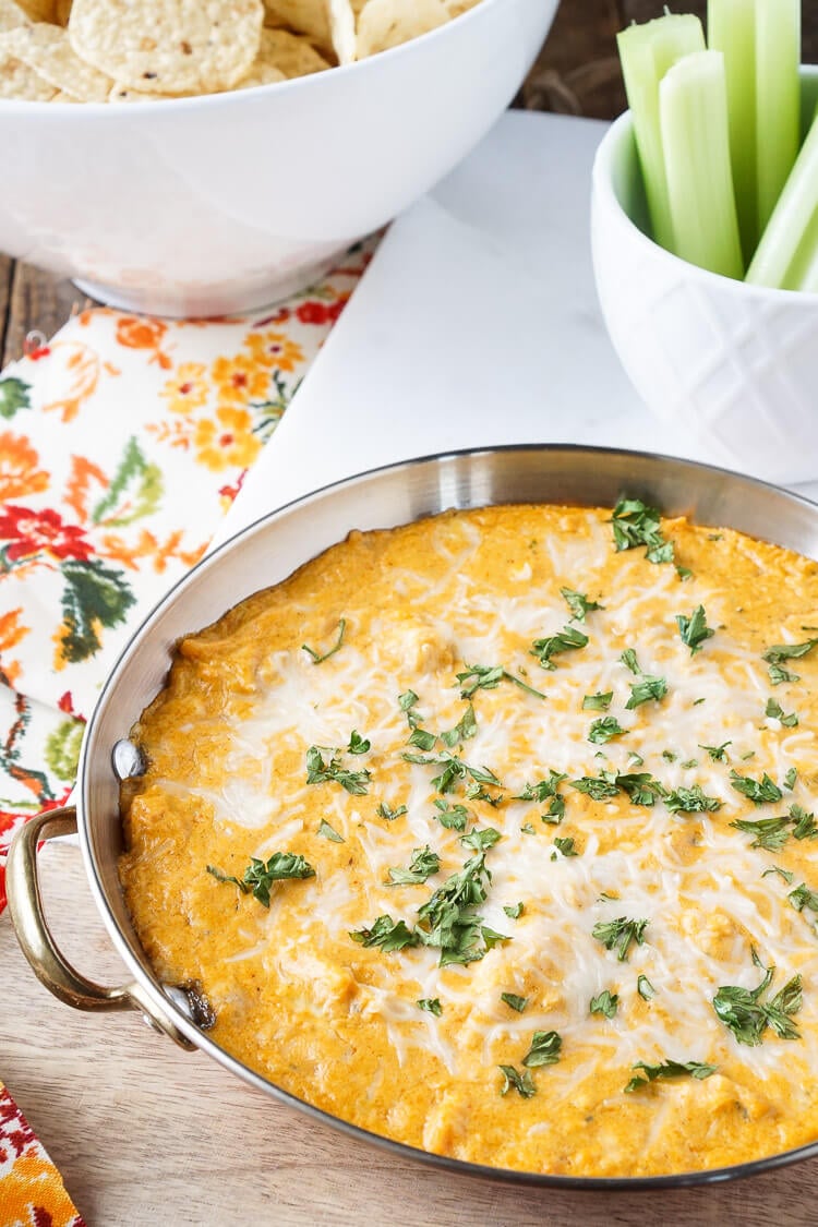 This Baked Buffalo Chicken Dip is made with real cream and blue cheeses, rotisserie chicken, hot sauce and spices for a sensational appetizer that's sure to please! Plus, it's ready in less than 30 minutes!