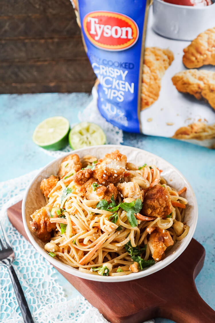 These Crispy Chicken Thai Peanut Noodles are a quick and easy meal that's perfect for weeknights! Crispy chicken tenders add a bit of crunch to this simple Thai inspired dish, on the table in just 30 minutes!