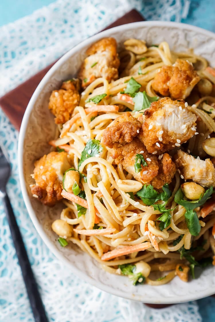 These Crispy Chicken Thai Peanut Noodles are a quick and easy meal that's perfect for weeknights! Crispy chicken tenders add a bit of crunch to this simple Thai inspired dish, on the table in just 30 minutes!