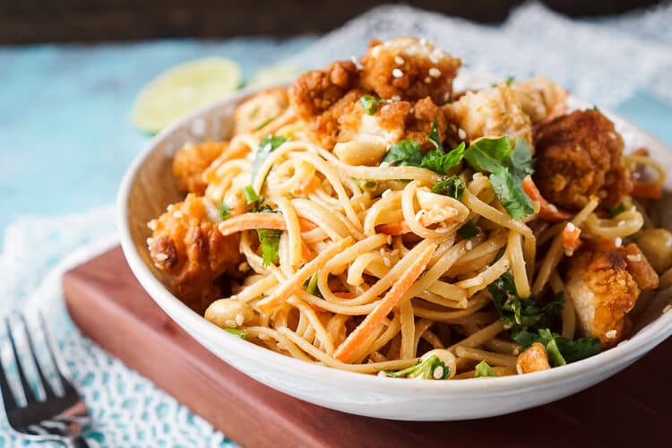 These Crispy Chicken Thai Peanut Noodles are a quick and easy meal that's perfect for weeknights! Crispy chicken tenders add a bit of crunch to this simple Thai inspired dish, on the table in just 30 minutes!