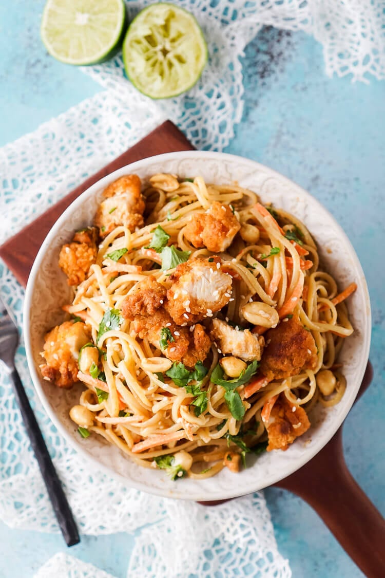 These Crispy Chicken Thai Peanut Noodles are a quick and easy meal that's perfect for weeknights! Crispy chicken tenders add a bit of crunch to this simple Thai inspired dish, on the table in just 30 minutes!