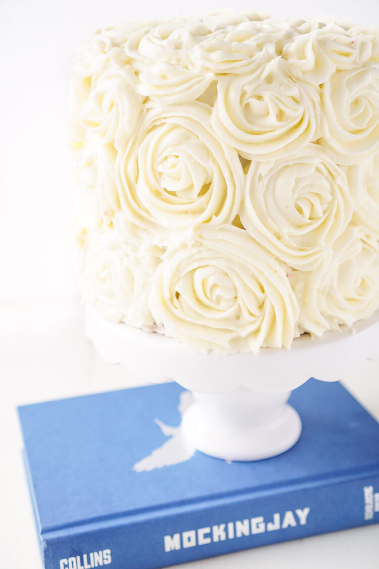 Red Velvet Cake, aka President Snow's White Rose Cake, is a red velvet cake frosted in cream cheese buttercream and inspired by The Hunger Games trilogy and perfect for Valentine's Day too!