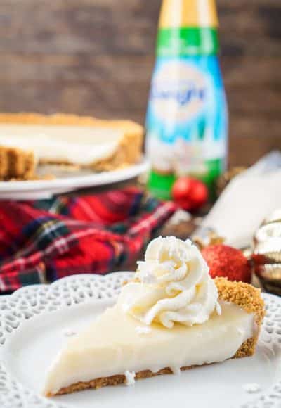 This literally tastes like Christmas, or at least those were the words out of my mother's mouth when she took her first bite! This Sugar Cookie Cream Tart has a sweet smooth filling wrapped in a graham cracker crust that's perfect for the holidays.
