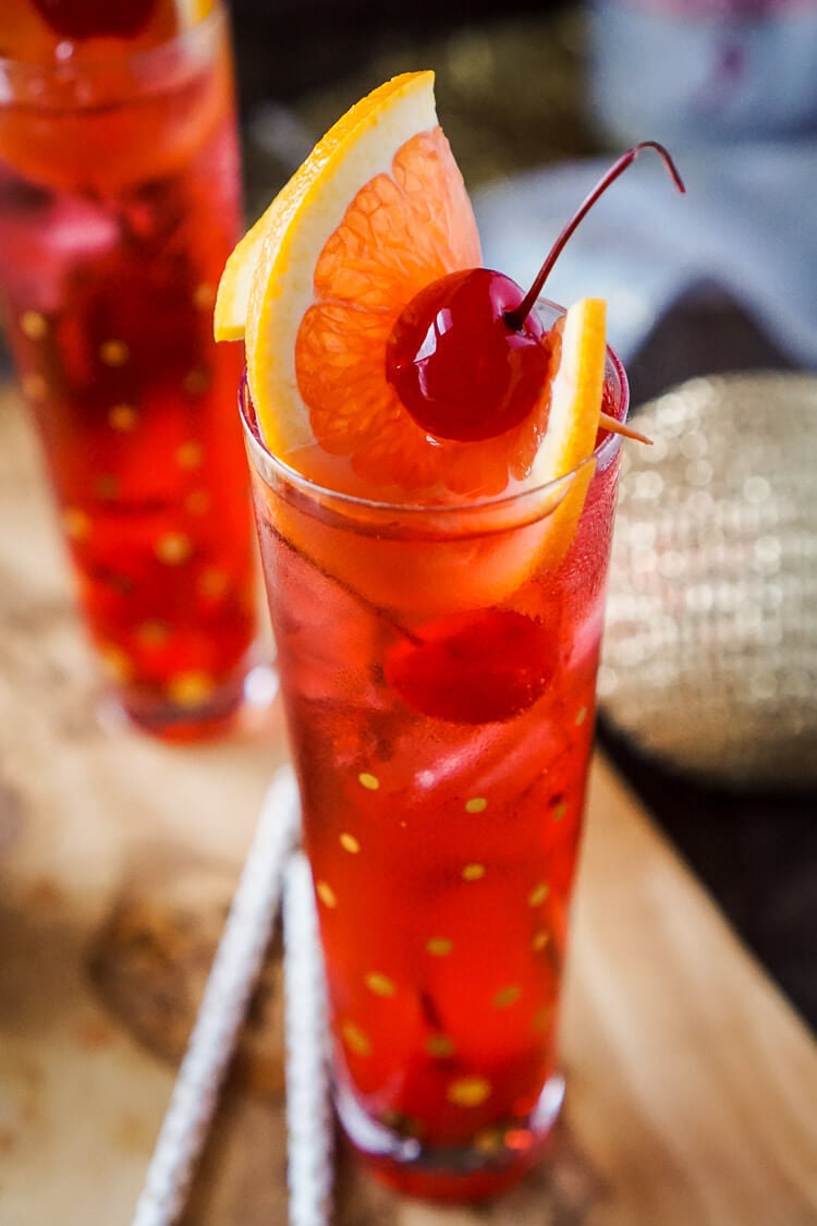 This Champagne Shirley Temple switches out soda for some bubbly for a twist on the classic! This is a great new years eve drink and perfect for other parties throughout the year! Just a few ingredients and you'll have a classy cocktail worth celebrating with!