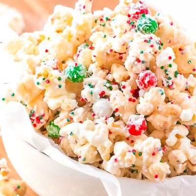 Close up photo of Christmas Popcorn in a small white bowl.