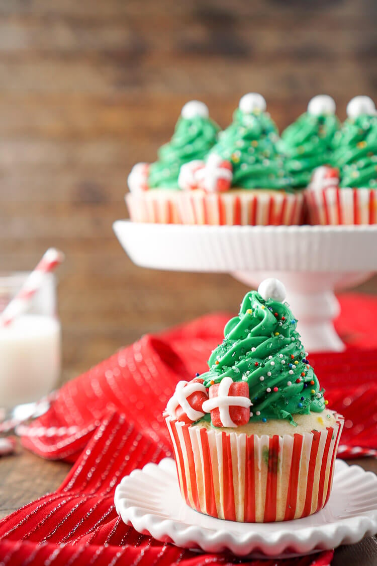 I love these Christmas Tree Cupcakes! They're so cute and great to make with the kids! Plus they're easier than they look and are such a fun and festive dessert for holiday parties!