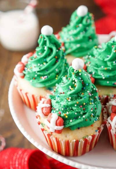 I love these Christmas Tree Cupcakes! They're so cute and great to make with the kids! Plus they're easier than they look and are such a fun and festive dessert for holiday parties!