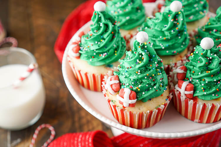 I love these Christmas Tree Cupcakes! They're so cute and great to make with the kids! Plus they're easier than they look and are such a fun and festive dessert for holiday parties!