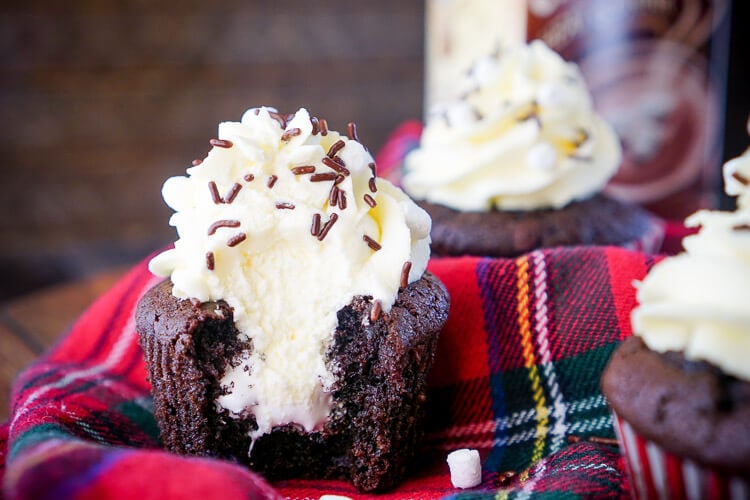 These Hot Chocolate Cupcakes are made with actual hot chocolate in the batter, filled with marshmallow fluff, and finished with a vanilla whipped cream frosting!