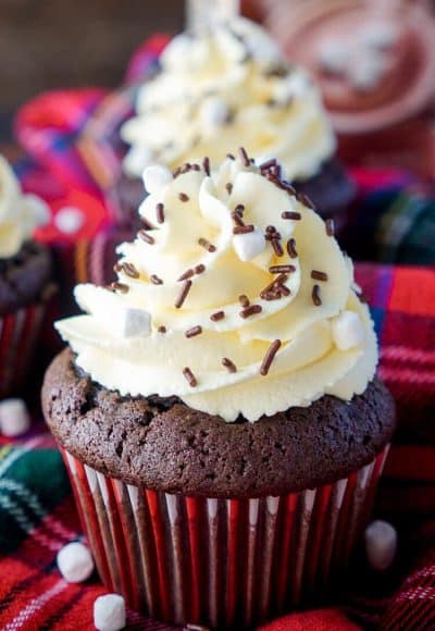 These Hot Chocolate Cupcakes are made with actual hot chocolate in the batter, filled with marshmallow fluff, and finished with a vanilla whipped cream frosting!