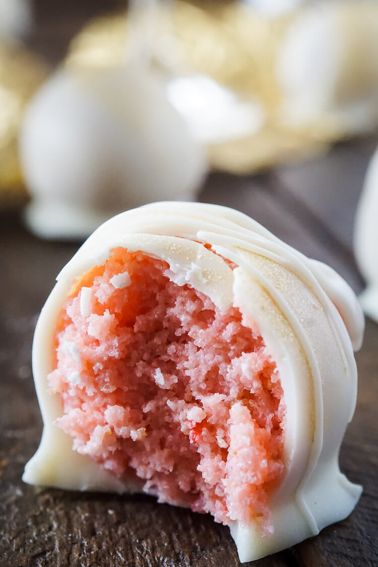 These Strawberries & Champagne Cake Balls are perfect for a New Year's Eve party, Valentine's Day, Bridal Showers and so much more! They make an easy dessert that tastes like fruity pebbles!