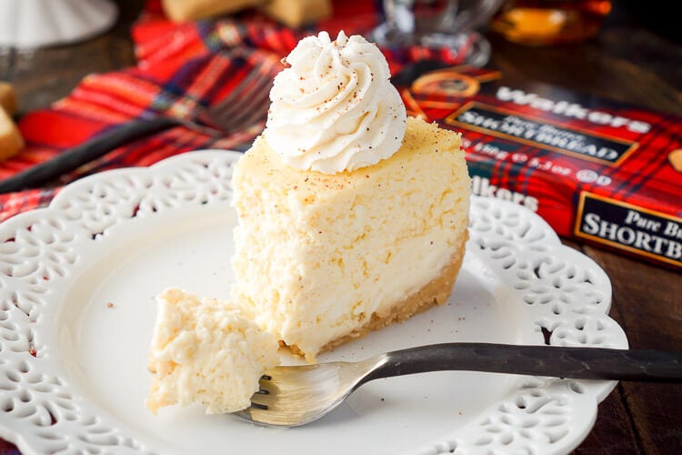 This Eggnog Cheesecake Recipe is enclosed in a sweet shortbread cookie crust and laced with whisky and nutmeg for the ultimate holiday dessert!