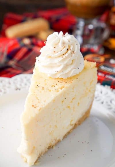 This Eggnog Cheesecake Recipe is enclosed in a sweet shortbread cookie crust and laced with whisky and nutmeg for the ultimate holiday dessert!