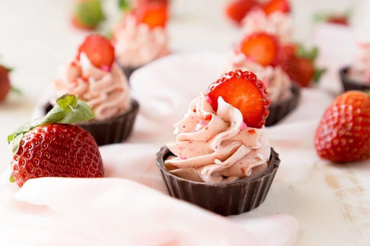 These Strawberry Mousse Cups are an easy dessert! A fluffy strawberry mousse is served in chocolate shells for a fun and simple treat that's great for Valentine's Day, baby showers, bridal showers, or anything else!