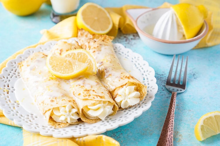 These Lemon Cheesecake Crepes are a rich and vibrantly flavored brunch! Make the batter up ahead of time in the blender and keep it in the fridge until you're ready to use, then you're just 20 minutes away from a plate of lemon heaven!