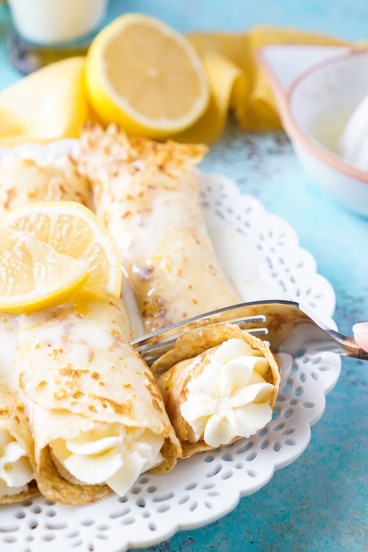 These Lemon Cheesecake Crepes are a rich and vibrantly flavored brunch! Make the batter up ahead of time in the blender and keep it in the fridge until you're ready to use, then you're just 20 minutes away from a plate of lemon heaven!