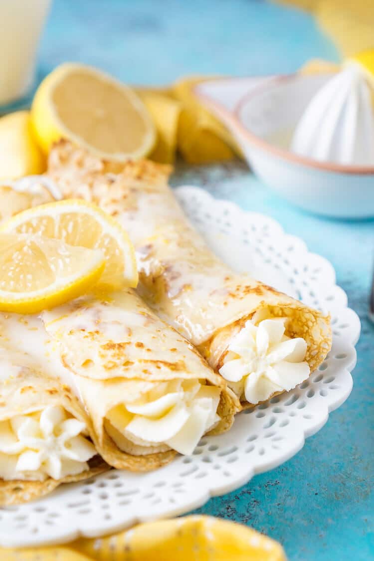 These Lemon Cheesecake Crepes are a rich and vibrantly flavored brunch! Make the batter up ahead of time in the blender and keep it in the fridge until you're ready to use, then you're just 20 minutes away from a plate of lemon heaven!