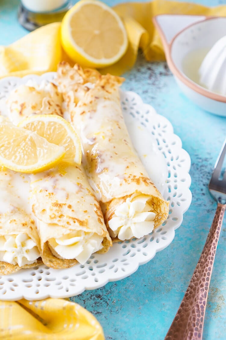 These Lemon Cheesecake Crepes are a rich and vibrantly flavored brunch! Make the batter up ahead of time in the blender and keep it in the fridge until you're ready to use, then you're just 20 minutes away from a plate of lemon heaven!