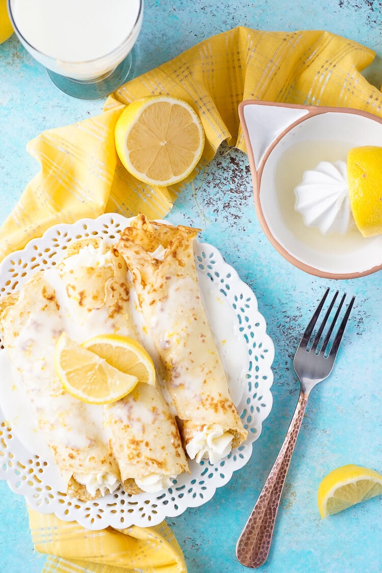 These Lemon Cheesecake Crepes are a rich and vibrantly flavored brunch! Make the batter up ahead of time in the blender and keep it in the fridge until you're ready to use, then you're just 20 minutes away from a plate of lemon heaven!