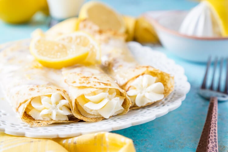 These Lemon Cheesecake Crepes are a rich and vibrantly flavored brunch! Make the batter up ahead of time in the blender and keep it in the fridge until you're ready to use, then you're just 20 minutes away from a plate of lemon heaven!