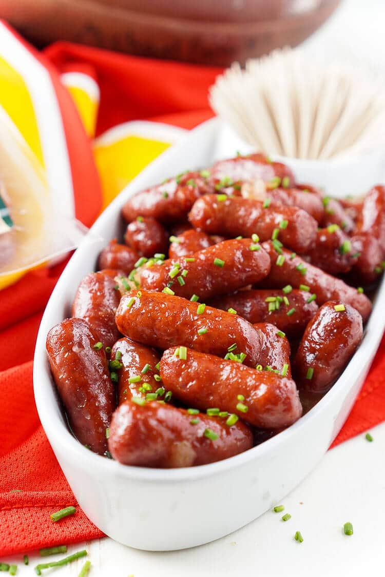 These Spicy Blood Orange Lit'l Smokies sausages are an easy appetizer with Asian flair and a hint of heat that's perfect for game days! Made in the crock pot and ready in less than 2 hours!