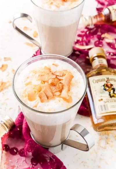 This Spiked Coconut Vanilla Steamer is one of the coziest winter cocktails you'll ever have! Made with real vanilla beans, coconut, milk, and spiced rum! It's delicious and frothy and topped with toasted coconut!