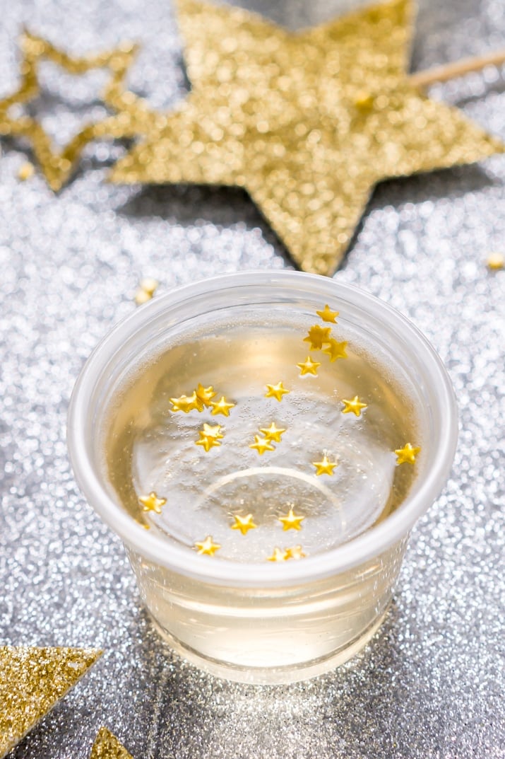 These Champagne Jello Shots are made with champagne, ginger ale, lemon juice, sugar, and gelatin and are so easy to whip up for your New Year's Eve and other celebrations!