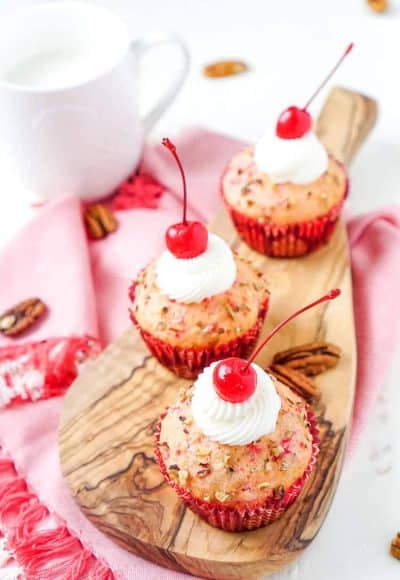 These Cherry Pecan Cream Cheese Muffins are a fun breakfast that borders on dessert! These muffins are loaded with cherry and pecan pieces and filled with a silky cream cheese filling with a hint of almond! Perfect for Valentine's Day or everyday!