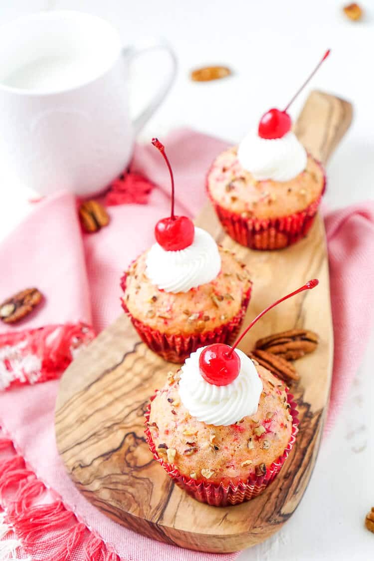 These Cherry Pecan Cream Cheese Muffins are a fun breakfast that borders on dessert! These muffins are loaded with cherry and pecan pieces and filled with a silky cream cheese filling with a hint of almond! Perfect for Valentine's Day or everyday!
