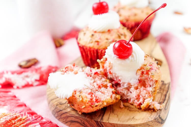 These Cherry Pecan Cream Cheese Muffins are a fun breakfast that borders on dessert! These muffins are loaded with cherry and pecan pieces and filled with a silky cream cheese filling with a hint of almond! Perfect for Valentine's Day or everyday!