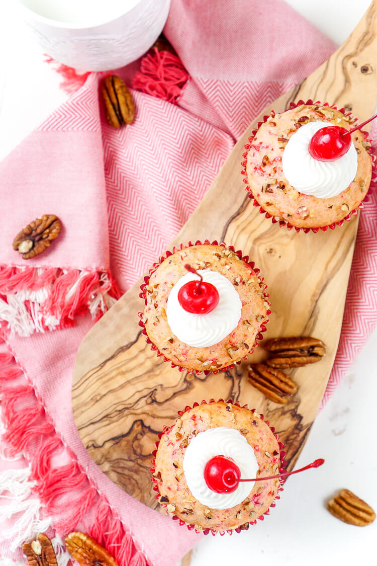 These Cherry Pecan Cream Cheese Muffins are a fun breakfast that borders on dessert! These muffins are loaded with cherry and pecan pieces and filled with a silky cream cheese filling with a hint of almond! Perfect for Valentine's Day or everyday!