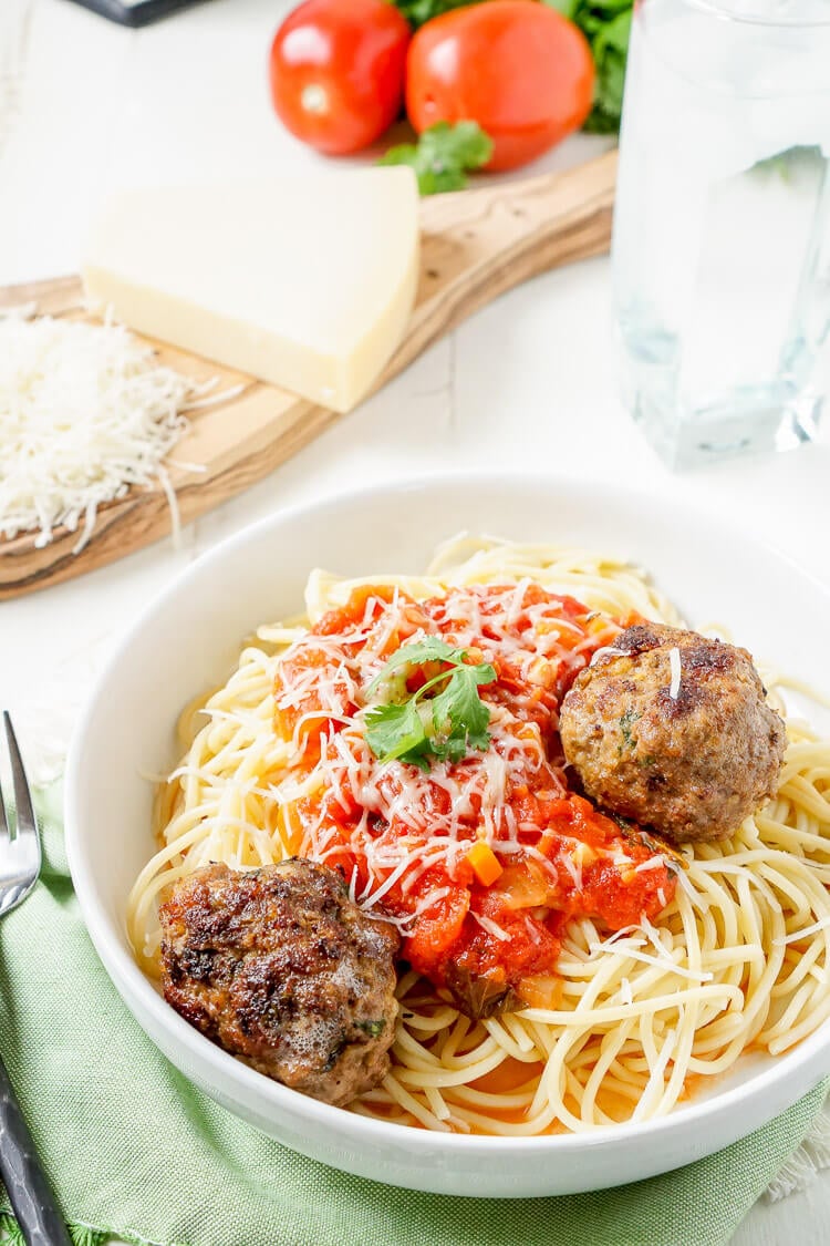 This Homemade Spaghetti and Meatballs recipe is loaded with classic Italian flavor the whole family will love!