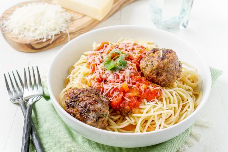 This Homemade Spaghetti and Meatballs recipe is loaded with classic Italian flavor the whole family will love!