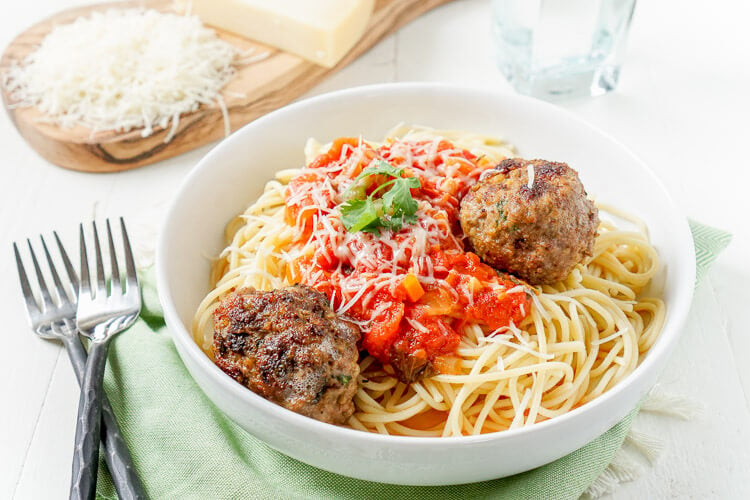 This Homemade Spaghetti and Meatballs recipe is loaded with classic Italian flavor the whole family will love!