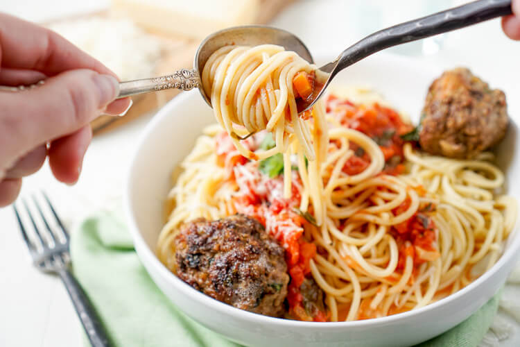 This Homemade Spaghetti and Meatballs recipe is loaded with classic Italian flavor the whole family will love!