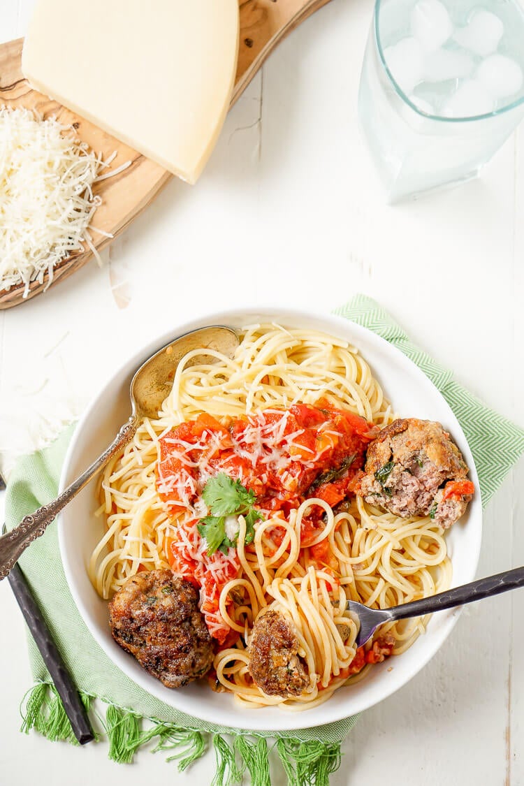 This Homemade Spaghetti and Meatballs recipe is loaded with classic Italian flavor the whole family will love!
