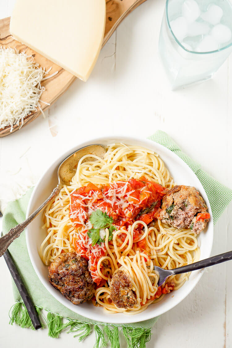 This Homemade Spaghetti and Meatballs recipe is loaded with classic Italian flavor the whole family will love!