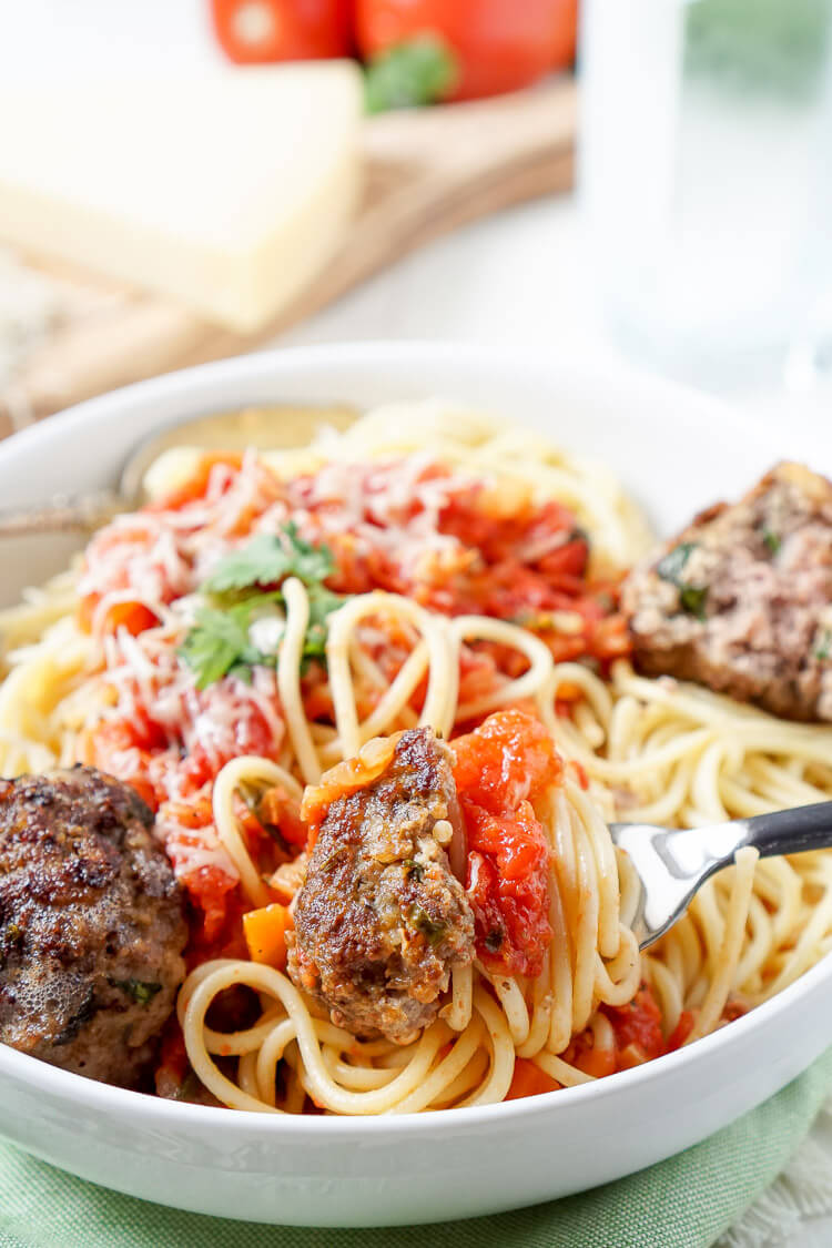 This Homemade Spaghetti and Meatballs recipe is loaded with classic Italian flavor the whole family will love!