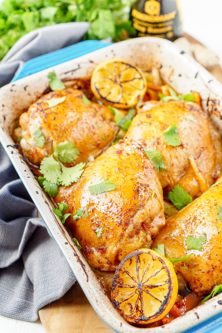 These Lemon Ginger Soy Chicken Thighs are slow roasted, tender, and bursting with flavor! The chicken thighs are basted throughout the roasting process with a simple sauce made with lemon, soy sauce, honey, and ginger. Roasted over a dish of bok choy and carrots, this dish is filled with Asian influence!