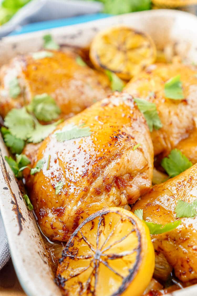 These Lemon Ginger Soy Chicken Thighs are slow roasted, tender, and bursting with flavor! The chicken thighs are basted throughout the roasting process with a simple sauce made with lemon, soy sauce, honey, and ginger. Roasted over a dish of bok choy and carrots, this dish is filled with Asian influence!