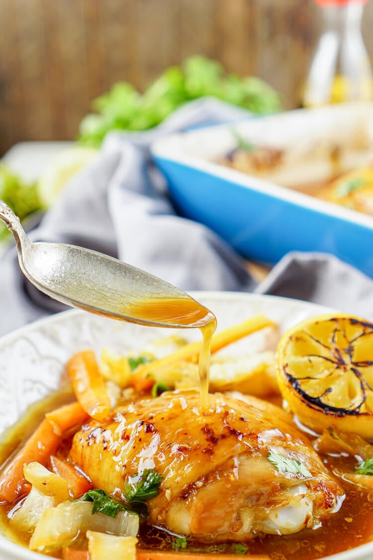 These Lemon Ginger Soy Chicken Thighs are slow roasted, tender, and bursting with flavor! The chicken thighs are basted throughout the roasting process with a simple sauce made with lemon, soy sauce, honey, and ginger. Roasted over a dish of bok choy and carrots, this dish is filled with Asian influence!