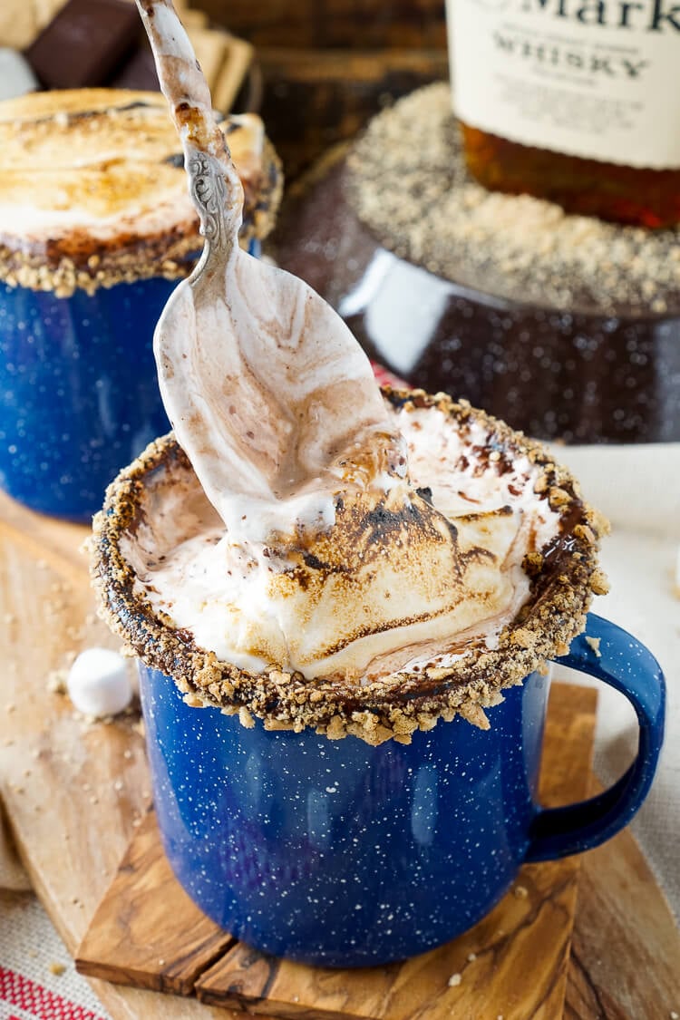 This Campfire S'mores Hot Chocolate Cocktail is laced with whiskey and honey for a smooth and cozy drink!