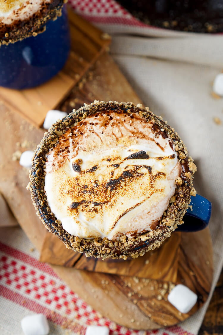 This Campfire S'mores Hot Chocolate Cocktail is laced with whiskey and honey for a smooth and cozy drink!