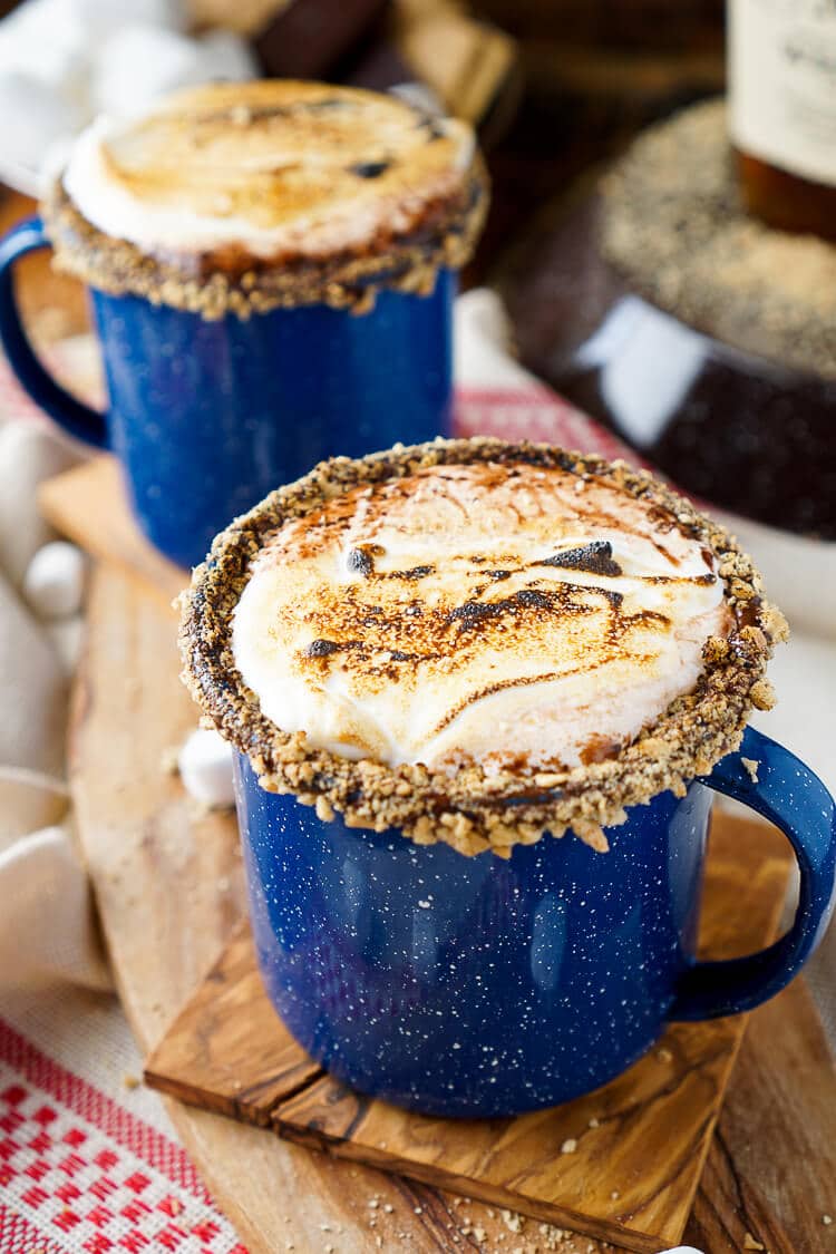 This Campfire S'mores Hot Chocolate Cocktail is laced with whiskey and honey for a smooth and cozy drink!